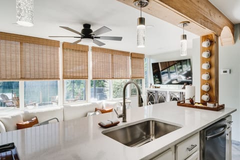 Kitchen is fully equipped with an electric stove with an oven, refrigerator, microwave, and a Keurig