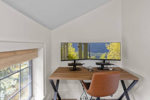 Separate work space with dual monitors located in the primary ensuite