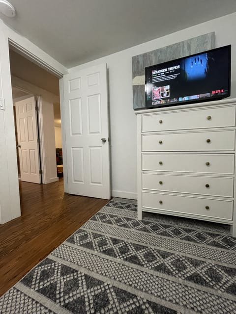 Bunk bedroom with two full mattresses and TV