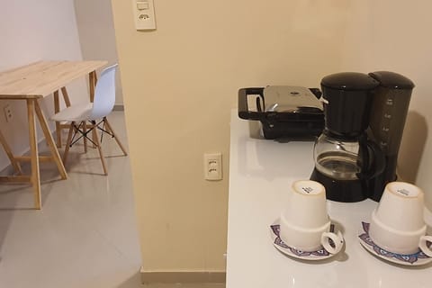 Fridge, coffee/tea maker, toaster, cookware/dishes/utensils