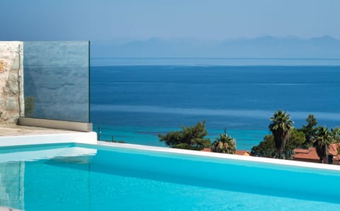 An infinity pool, sun loungers