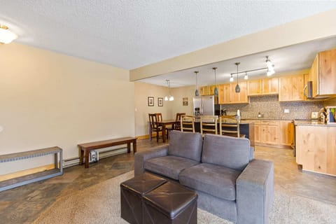 The seating area off of the entry allows you to kick up your feet and warm up by the fire while showing the close proximity of the living spaces to the kitchen and dining areas. Two benches welcome you in the entry as well.