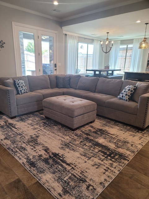 Living room with view of kitchen table in the background