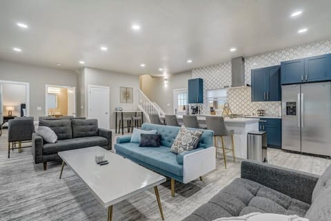 As you walk in, you will be greeted by 10ft+ ceilings and the open floorplan on the main level to include the kitchen, a large built in island, living room, dining room, breakfast table, and. the washer and dryer right there for easy access!