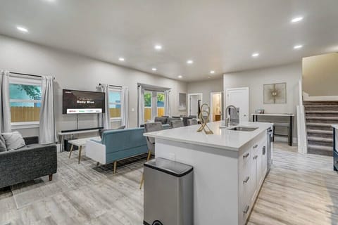 Our Rental Features an Open Layout Design, where the Kitchen, Living Room, and Dining Area Harmoniously Coexist, Offering Seamless Flow and Easy Living