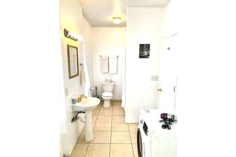 Combined shower/tub, hair dryer, towels, soap