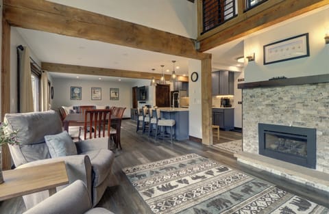 Living room features a cozy fireplace area