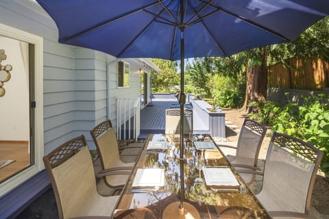 Outdoor entertainment area with a table for six. 