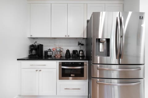 Coffee station with both drip coffee and coffee pod options, plus a toaster and a family-size Ninja air fryer — everything you need for easy and convenient meals while traveling.