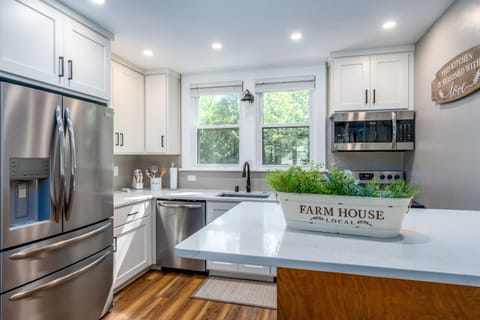 Fully renovated open concept kitchen, living, and dining area. Stainless appliances and quartz counters make this fully equipped kitchen bright