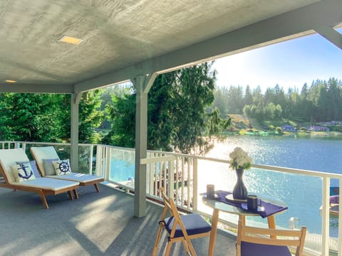 Take in breathtaking views of the lake from the comfort of the covered deck.