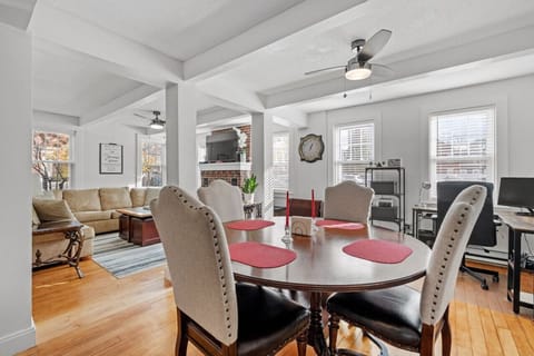 Step into the timeless charm of our historic condo, where the open layout seamlessly blends the dining room, living room, office area, and kitchen into a harmonious space.