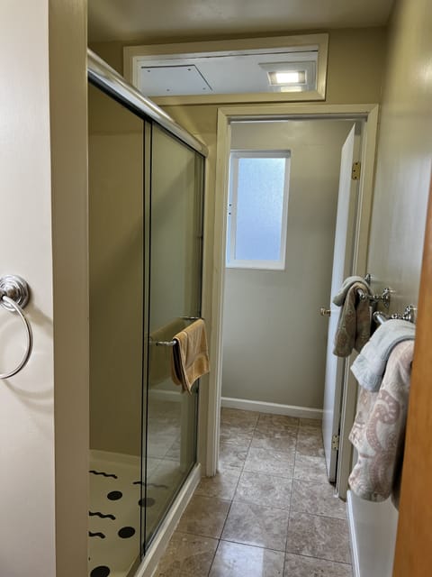 Combined shower/tub, hair dryer, towels, soap