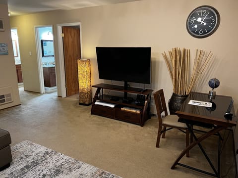 Living Room - LCD TV, desk w/chair, large sofa, AC/heater unit
