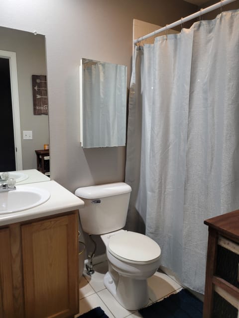 Combined shower/tub, hair dryer, towels, soap