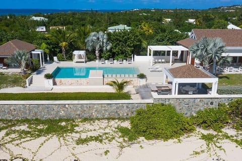 An infinity pool, a heated pool, sun loungers