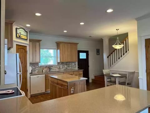 Kitchen Area & Stairs In The Background