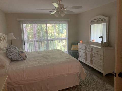 King bed in master bedroom access to screened in porch