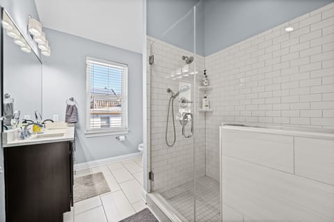 Combined shower/tub, hair dryer, towels, soap