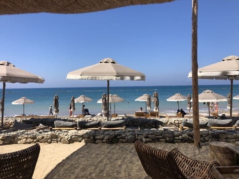 On the beach, sun loungers, beach towels