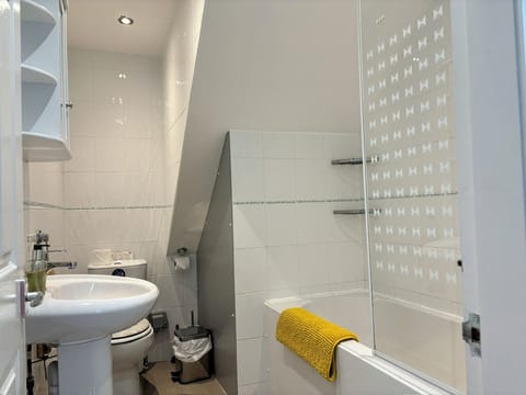 Combined shower/tub, hair dryer, towels, toilet paper