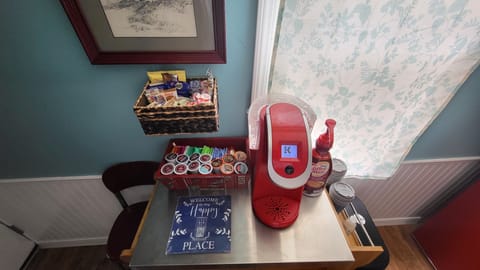 Keurig with assortment of coffee, teas, biscotti, biscuits,creamers, non dairy