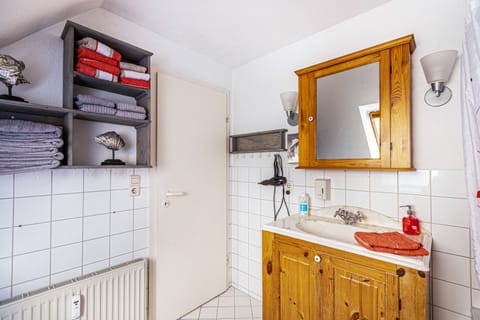 Bathtub, hair dryer, towels