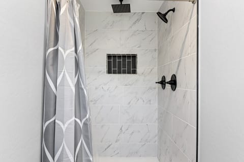 Combined shower/tub, hair dryer, towels, soap