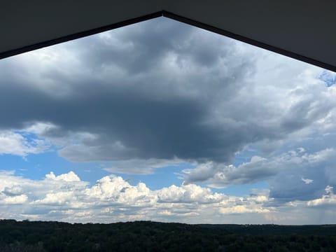 A view to the clouds above from a comfy chair on the back porch.