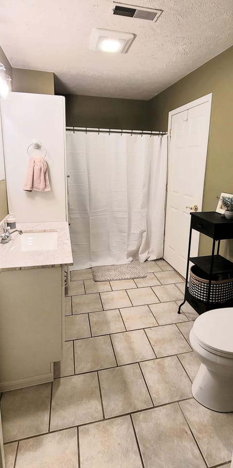 Combined shower/tub, hair dryer, towels, soap