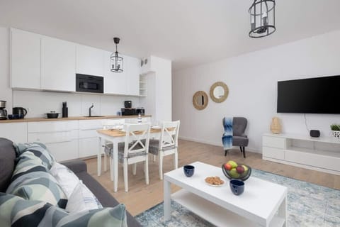 The living room featuring a sofa, which can be converted into a bed for two people.