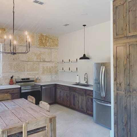 The microwave is located inside the pantry.