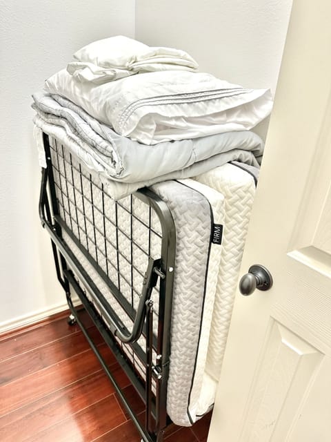 Twin rollaway bed in master closet