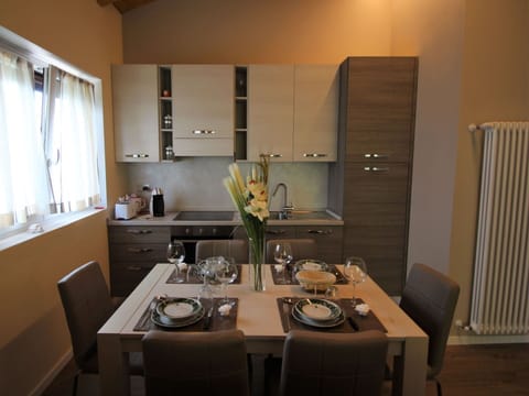 Table, Furniture, Property, Cabinetry, Window, Tableware, Chair, Wood, Interior Design, Kitchen & Dining Room Table