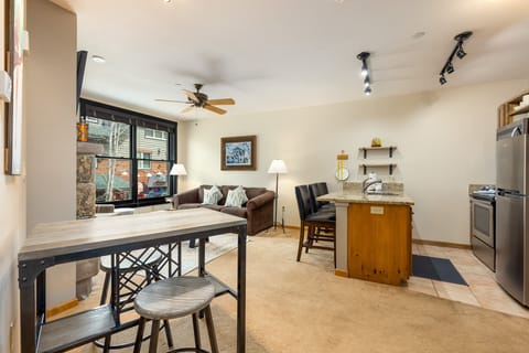 Open concept kitchen, dining, and living area.