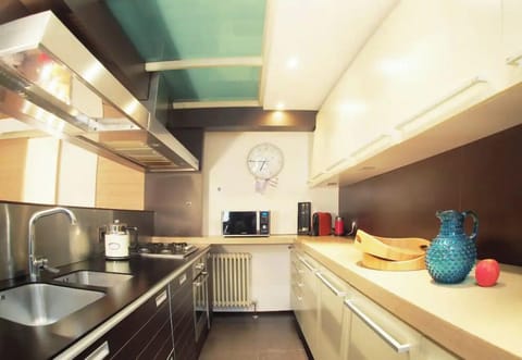 Kitchen with a dishwasher, stove, oven, and coffee maker