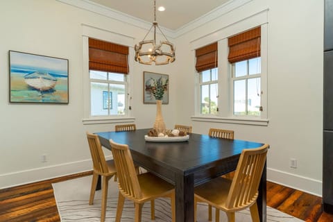 Tasteful Beach Motif throughout Dining Area with Seating for (6) and Kitchen Counter Seating for (4).