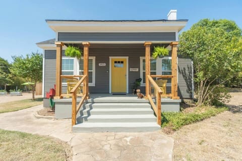 The bright and sunny porch of the main house with seating for morning coffee and quiet time.