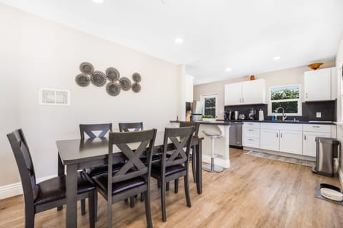 Dining table located directly off the kitchen and seats six.