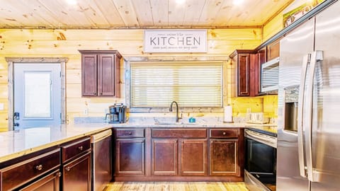 Enter into the home to find our open fully-equipped kitchen.
