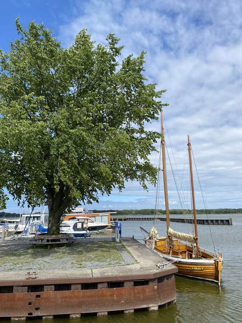 Sky, Cloud, Blue, Building, Yellow, Electricity, Urban Design, City, Facade, Crane