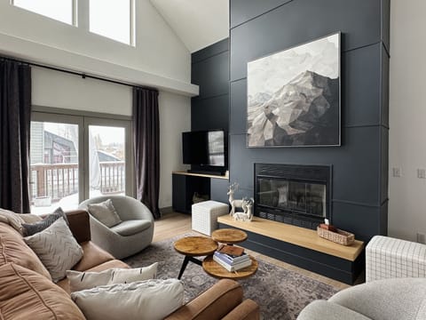 Silverthorne vacation rental living room with gas fireplace, smart TV, and premium soundbar for movie nights and relaxing evenings.