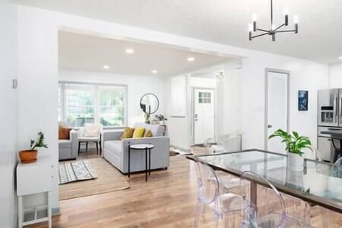 Open living space connecting the kitchen, dining area, and living room