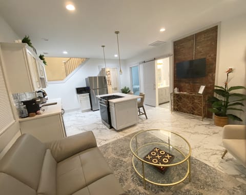 Living Room/ Kitchen. Smart TV with basic cable and streaming apps.