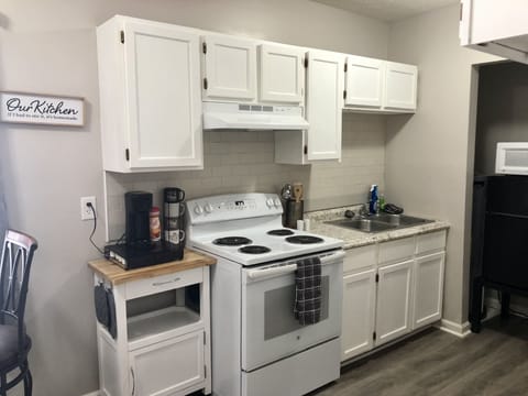 Fridge, microwave, stovetop, coffee/tea maker