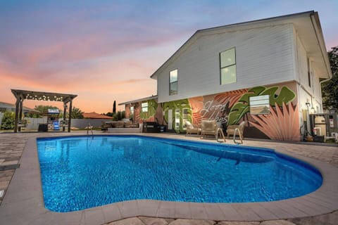 A heated pool, sun loungers