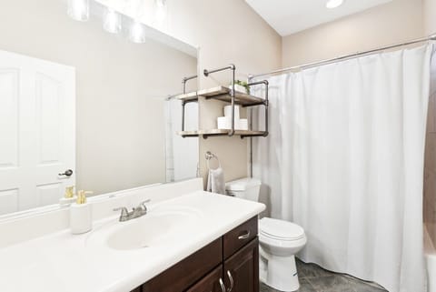 Combined shower/tub, hair dryer, towels, soap