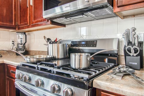 Gas stove, griddle, pots and pans.