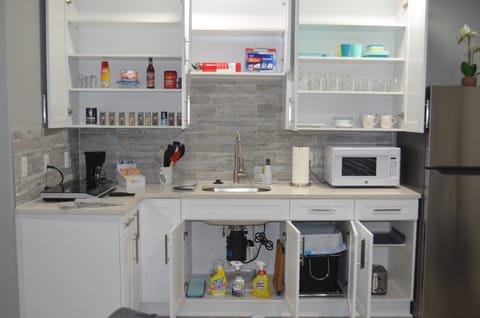 Fridge, microwave, stovetop, coffee/tea maker