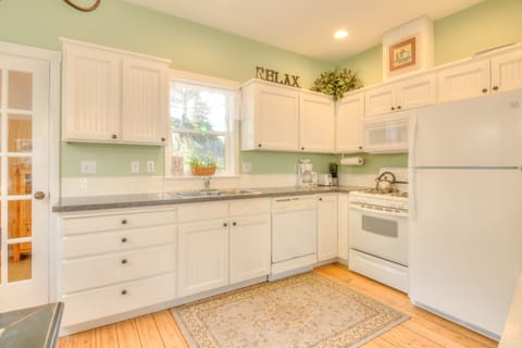 Kitchen with white interiors